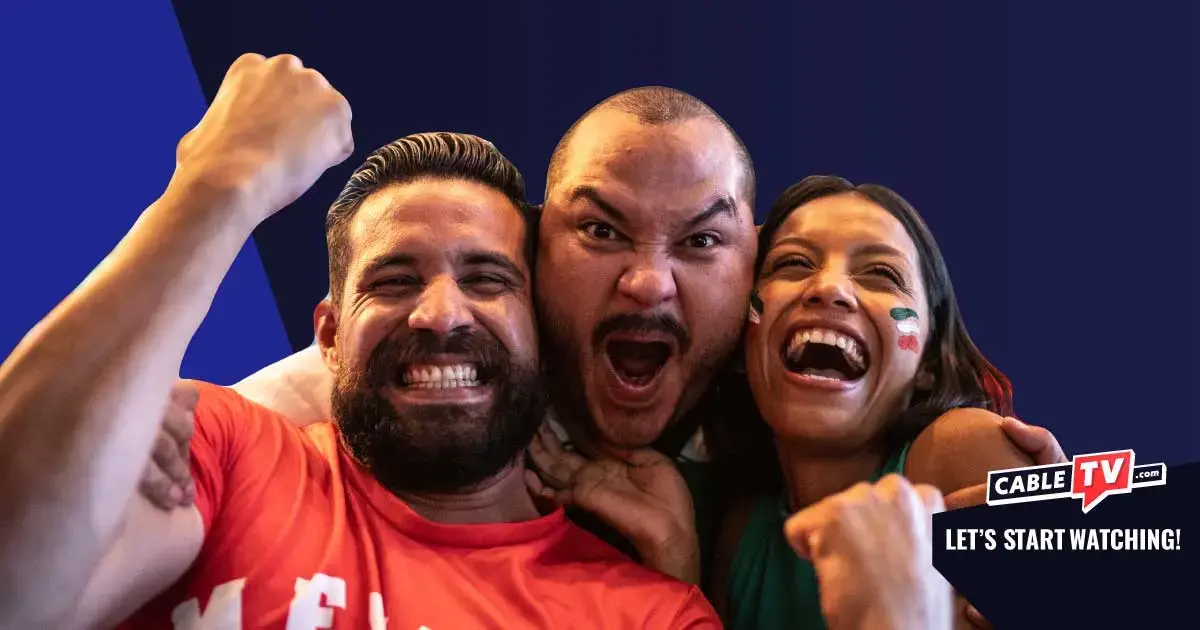 Three sports fans cheering at the camera.