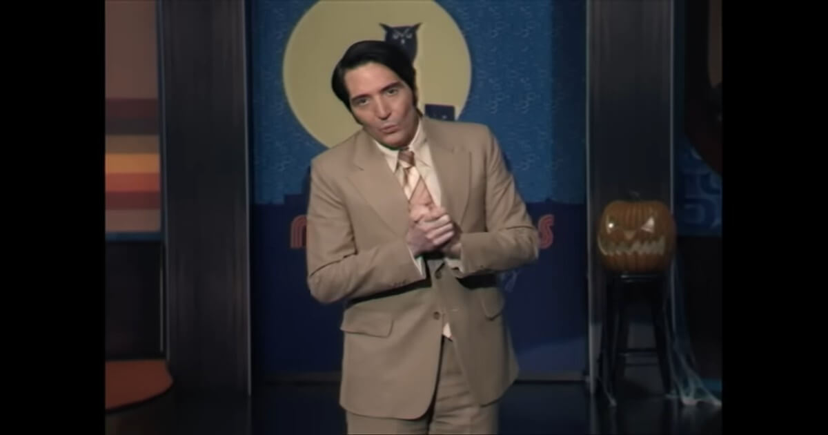 In a scene from Late Night with the Devil, a late-night talk-show host addresses the unseen studio audience.