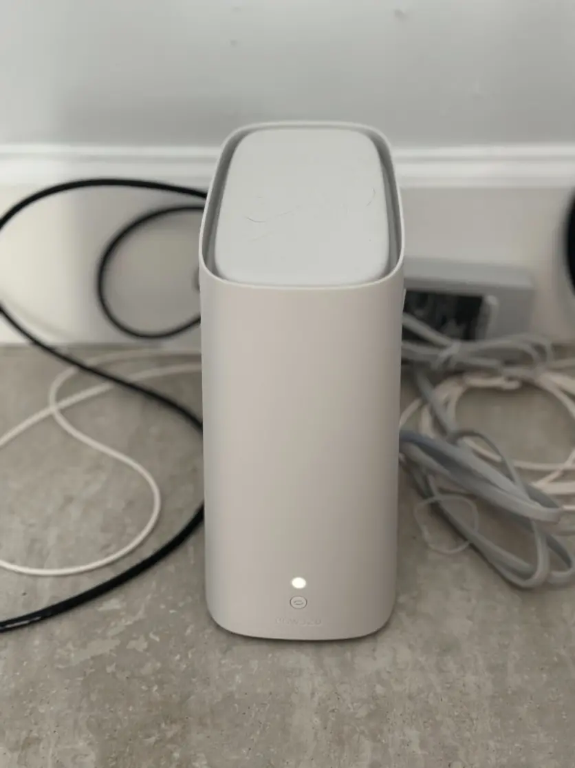 A photo of AT&T's Wi-Fi gateway device for fiber internet customers. It's a small white box connected to the internet.