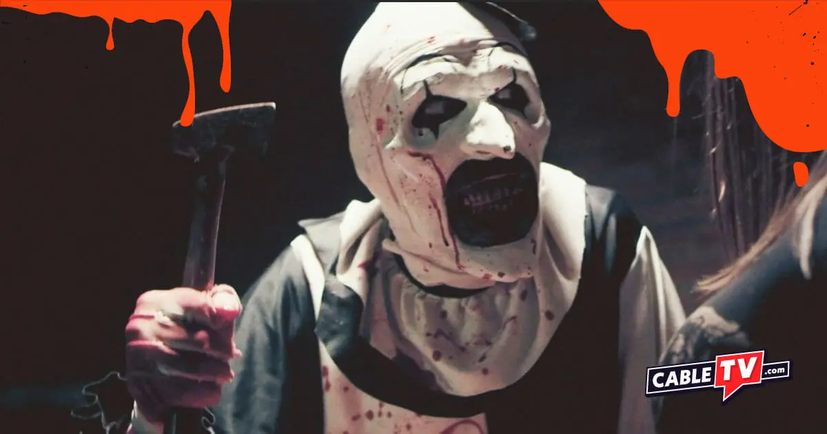 Image of a clown brandishing a hatchet—and baring a mouthful of bloody teeth.